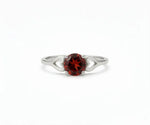 Garnet ring with deep red gemstone that exudes classic elegance and rich sophistication
