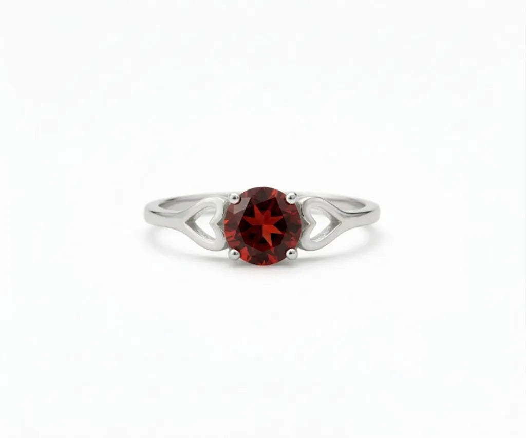 Garnet ring with deep red gemstone that exudes classic elegance and rich sophistication