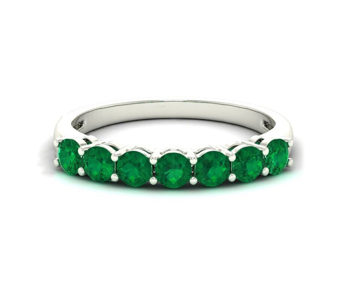 Modern sterling silver band ring with rich green emerald hydro gem, blending sophistication and natural charm
