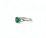 Emerald and gold ring that radiates timeless elegance with a vibrant green gemstone centerpiece

