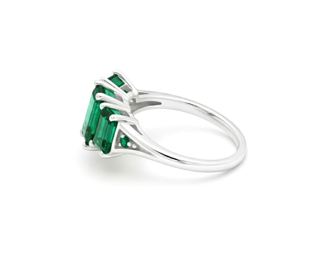 Sterling silver emerald ring with white zircon stones creating a classic and radiant gemstone statement ring