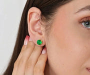 Emerald stud earrings in gold setting featuring vibrant green gemstone, elegant minimalist jewelry for everyday wear and special occasions