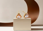 Load image into Gallery viewer, 18K yellow gold-plated studs with 7mm Blush Morganite stones.
