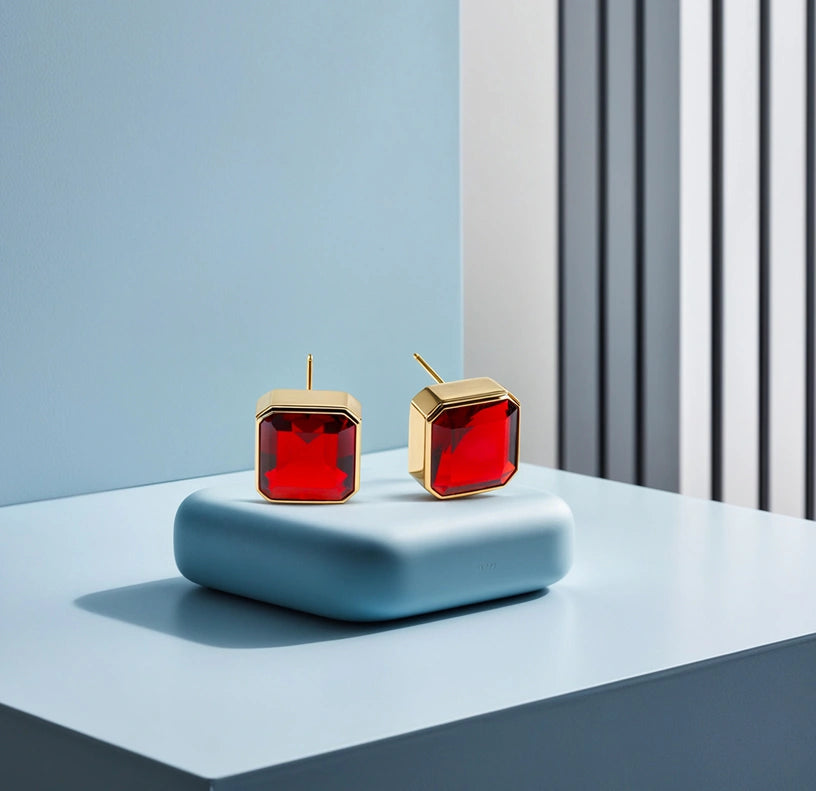 Stylish 10mm Asscher cut Fiery Garnet studs in yellow gold plating.