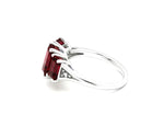 Garnet with white zircon statement ring in sterling silver showcasing a vibrant red center stone with delicate shimmering details
