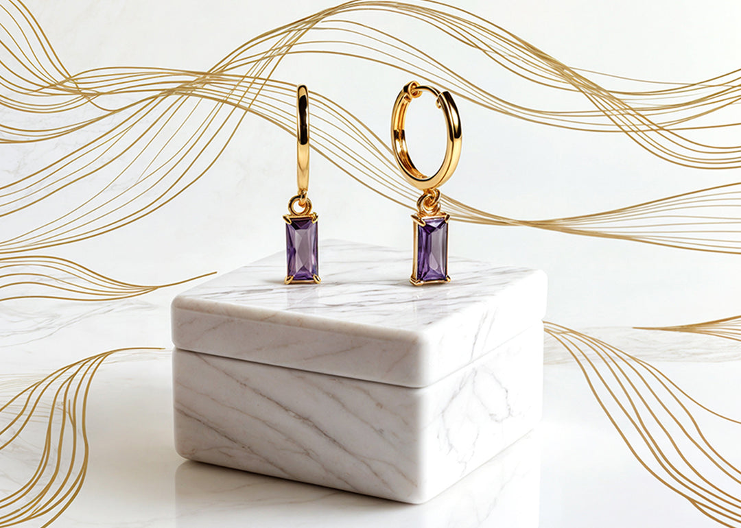 Gold hoops earrings featuring baguette-cut purple amethyst stone

