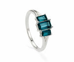 Indigolite tourmaline ring with sparkling white zircon accents set in polished sterling silver for a bold yet elegant gemstone look
