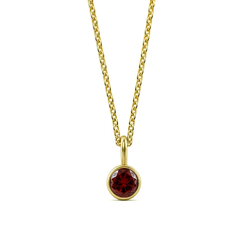 This garnet birthstone necklace features a deep red gemstone, beautifully set in a classic pendant necklace for women.


