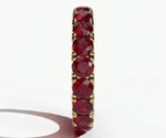 Elegant red ruby eternity ring for women featuring round cut stones in a timeless band design
