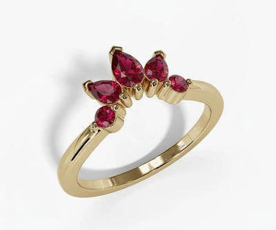 Pear cut lab red ruby ring with deep crimson gemstone set in an elegant polished band