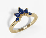 Pear cut lab blue sapphire ring with deep royal blue gemstone set in a sleek elegant band
