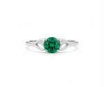 Vibrant emerald ring set in sterling silver, combining timeless elegance with a pop of rich green color
