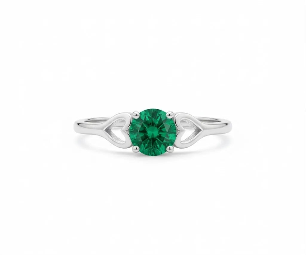 Vibrant emerald ring set in sterling silver, combining timeless elegance with a pop of rich green color
