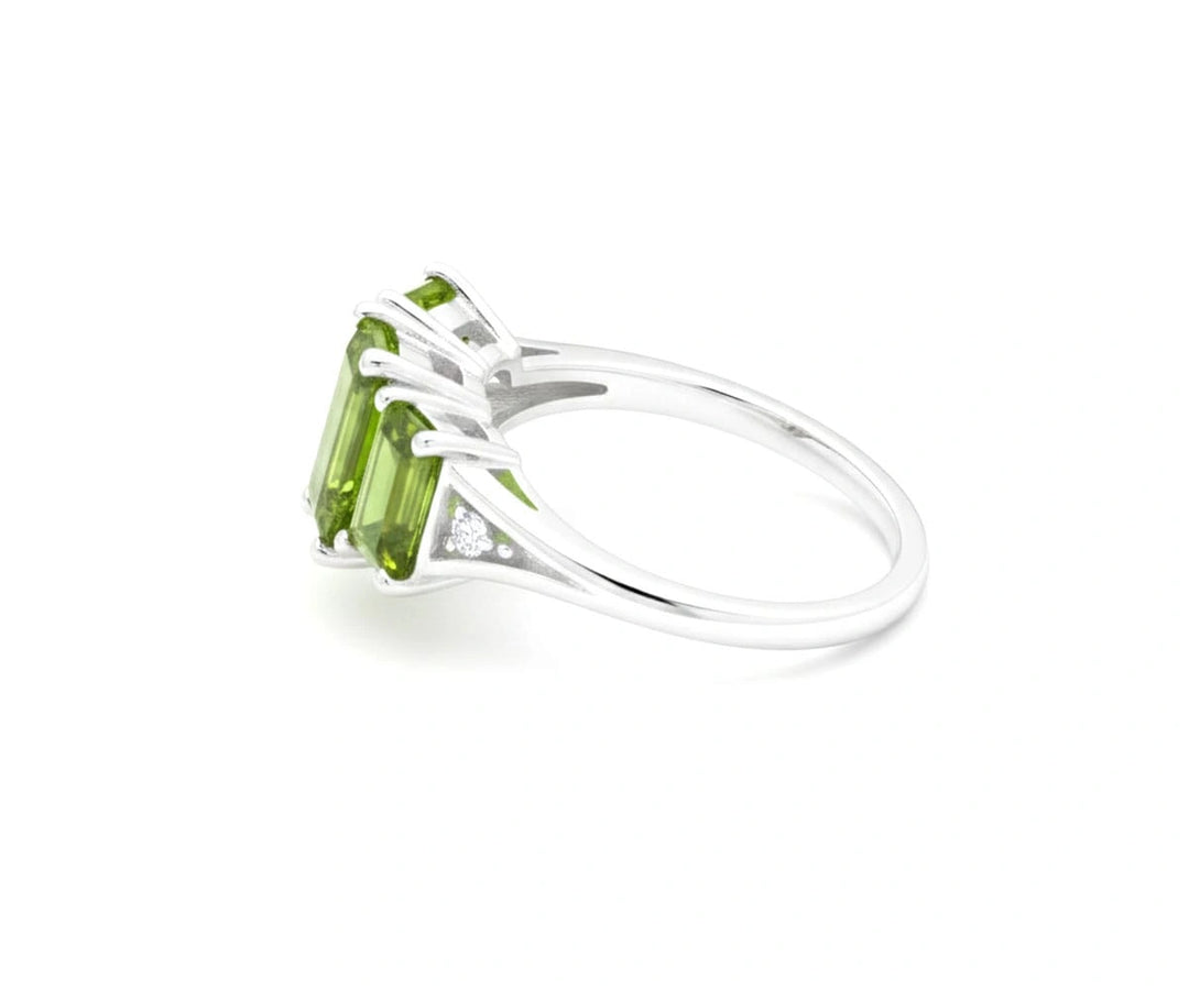 Sterling silver peridot and white zircon ring featuring a bright August birthstone center with shimmering crystal accents