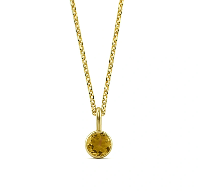 This citrine birthstone necklace features a warm golden-yellow gemstone set in a radiant pendant necklace for women.

