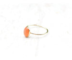Oval peach moonstone ring with warm red-orange tones set on a slender 1mm band in gold filled or sterling silver



