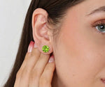 Peridot stud earrings in dainty gold setting featuring vibrant green August birthstone gemstone for everyday elegance
