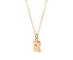 Dainty initial necklace with letter R pendant in gold on a delicate chain for everyday wear
