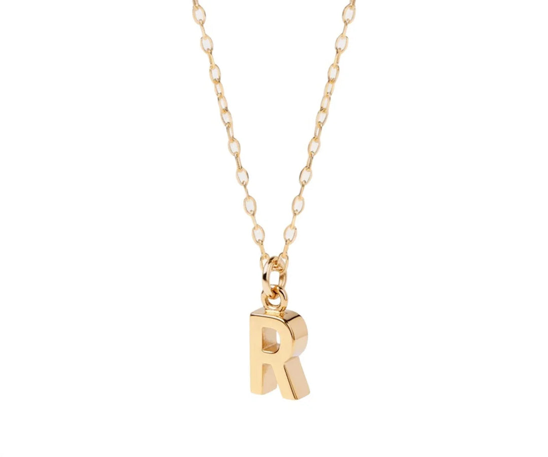 Dainty initial necklace with letter R pendant in gold on a delicate chain for everyday wear