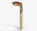 Vintage inspired ruby ring with pear cut red gemstone and delicate refined setting
