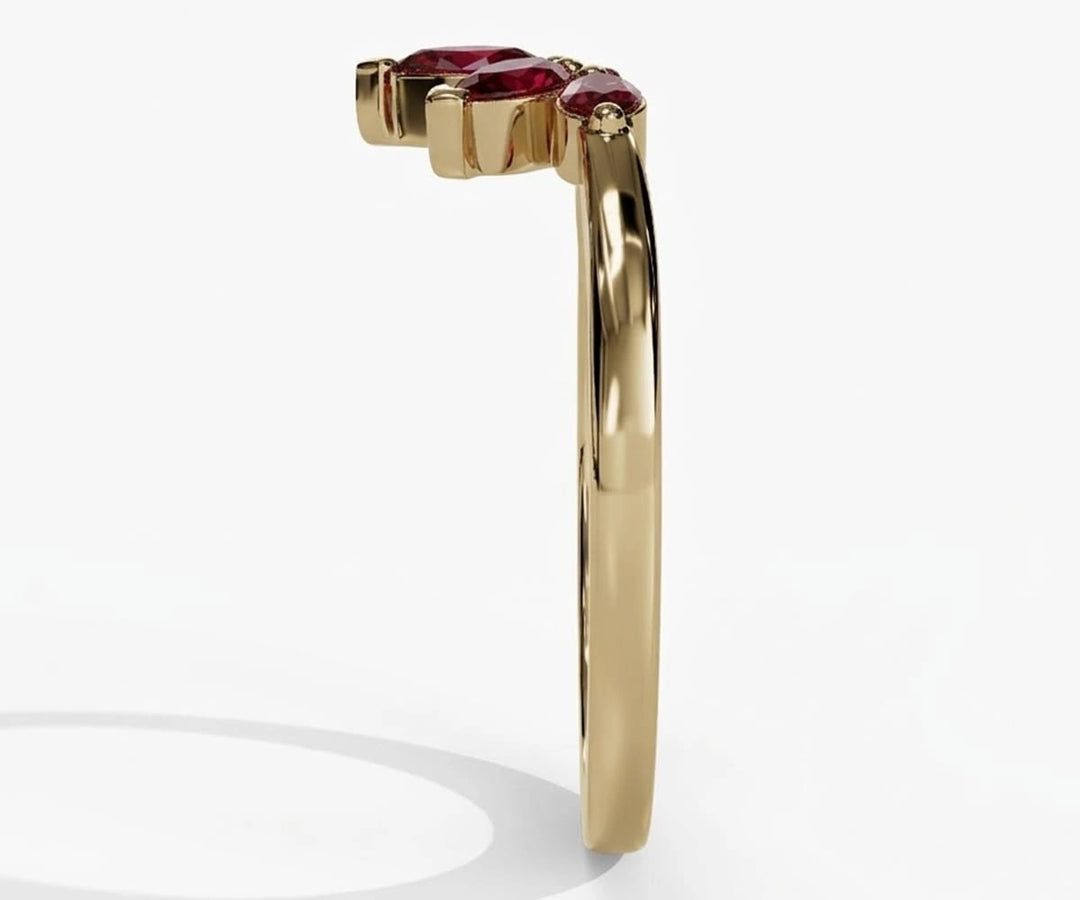 Vintage inspired ruby ring with pear cut red gemstone and delicate refined setting