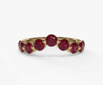 Elegant red ruby ring featuring a round cut lab ruby gemstone set in a classic silver band
