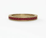 Elegant half eternity ruby ring for women featuring round red gemstones in a sleek minimalist band
