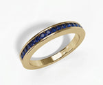 Round cut lab blue sapphire half eternity band ring with brilliant blue stones in a sleek elegant setting
