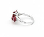 Sterling silver ruby ring with brilliant white zircon accents offering classic sparkle and deep red elegance
