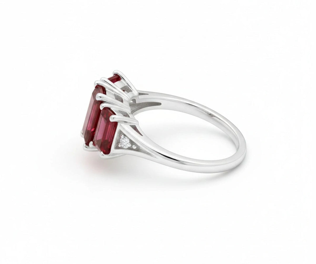 Sterling silver ruby ring with brilliant white zircon accents offering classic sparkle and deep red elegance