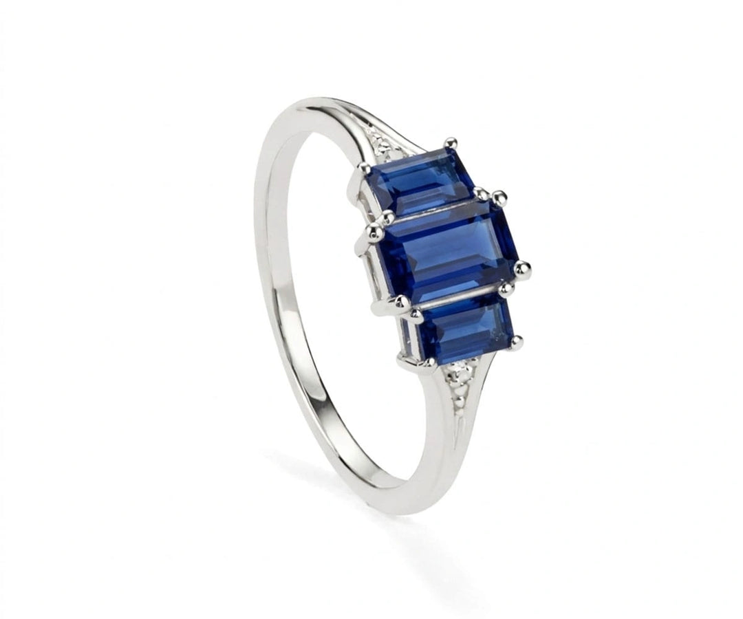 Sapphire and white zircon sterling silver ring featuring a deep blue gemstone with sparkling zircon accents for timeless elegance