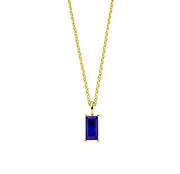 This blue sapphire birthstone necklace showcases a deep royal blue stone, designed as a timeless pendant necklace for women.

