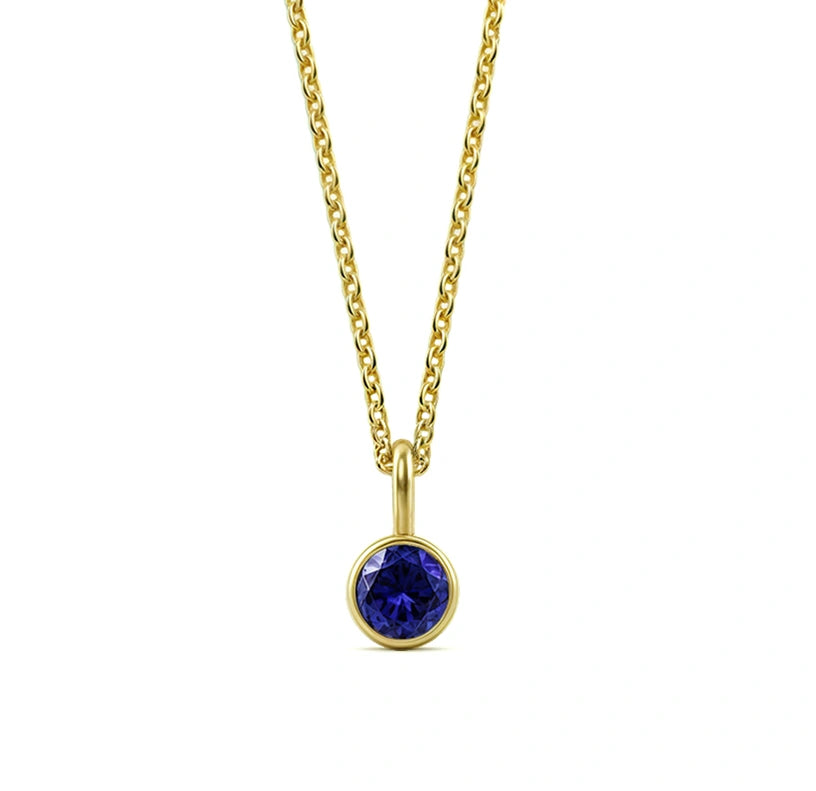 This blue sapphire birthstone necklace features a deep royal blue stone set in an elegant pendant necklace for women.


