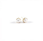 Oversized 10mm freshwater pearl studs on display
