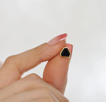 Statement black onyx earrings set in gold, offering contrast and sophistication.


