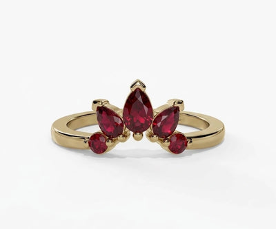 Red ruby engagement ring featuring a teardrop pear shaped stone with rich vibrant sparkle