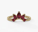 Red ruby engagement ring featuring a teardrop pear shaped stone with rich vibrant sparkle
