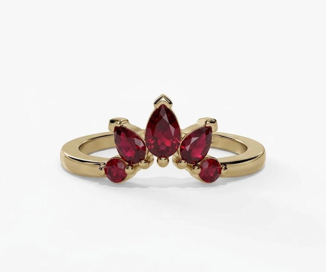 Red ruby engagement ring featuring a teardrop pear shaped stone with rich vibrant sparkle