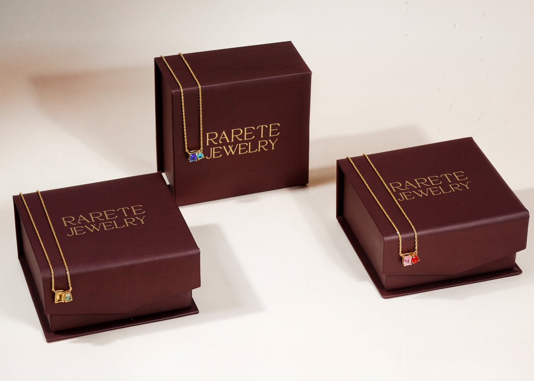 Delicate blue sapphire and ocean topaz necklace on display