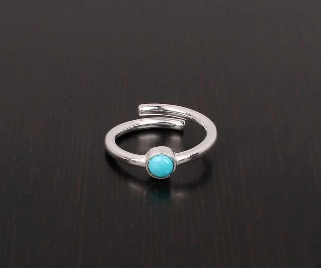 Artisan turquoise gemstone ring with radiant silver setting and bold, bohemian charm

