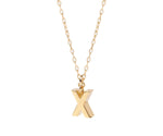 Dainty letter X necklace in gold with a minimalist initial pendant on a delicate chain
