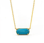 Custom-cut turquoise gemstone necklace with high-polish gold plating and 2-inch extender, perfect for layered or solo styling.
