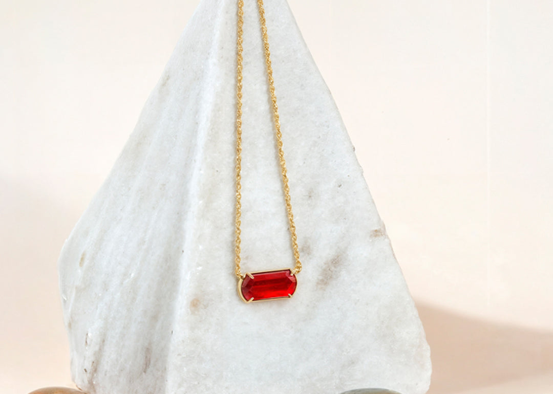 Close-up of ruby gemstone with gold finish