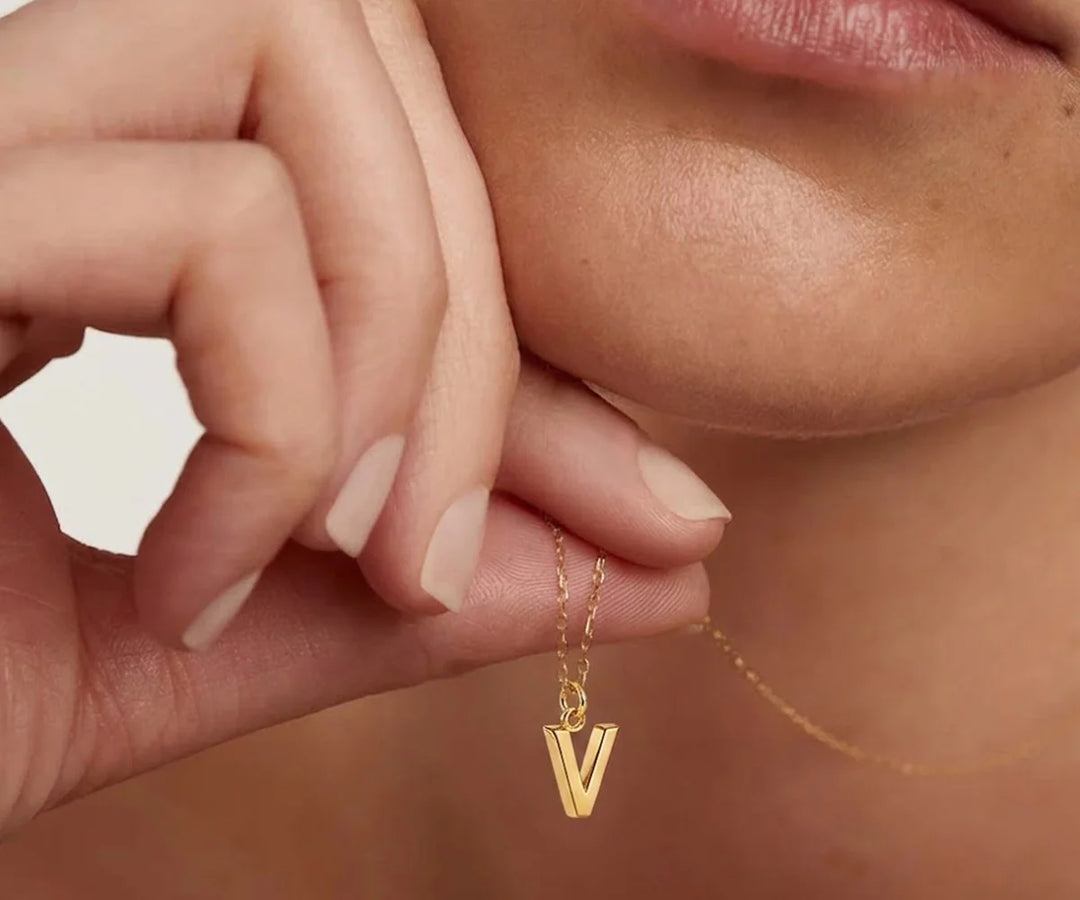 Elegant V initial necklace gold featuring a fine chain perfect for everyday wear
