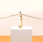 Load image into Gallery viewer, Chic dainty necklace with a gold letter J pendant, capturing understated sparkle on an adjustable anchor chain with a secure clasp.
