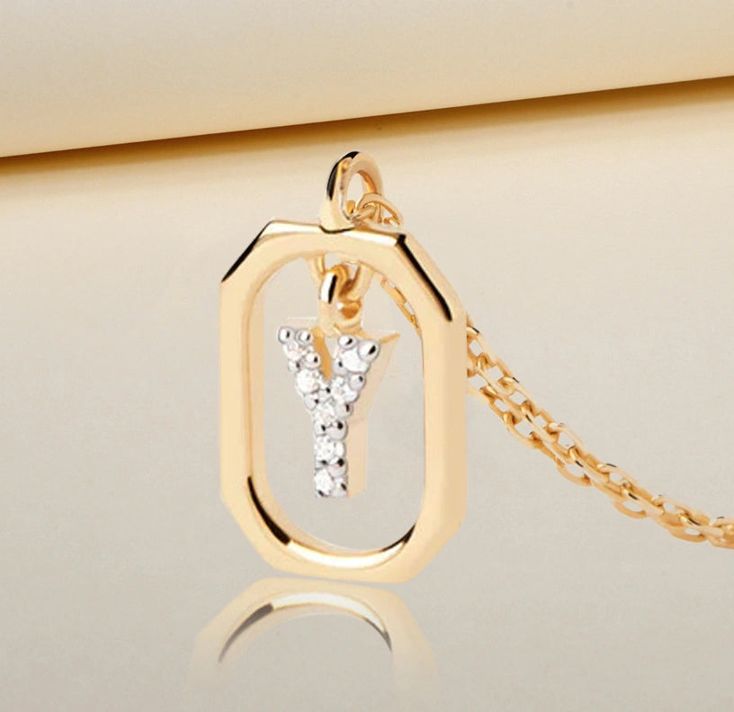 "Elegant gold-plated necklace with a dangling Y initial pendant, studded with sparkling white zircons on a delicate anchor chain"