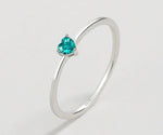 Minimalist heart ring featuring a pale green aquamarine, crafted in 925 silver for delicate everyday wear.

