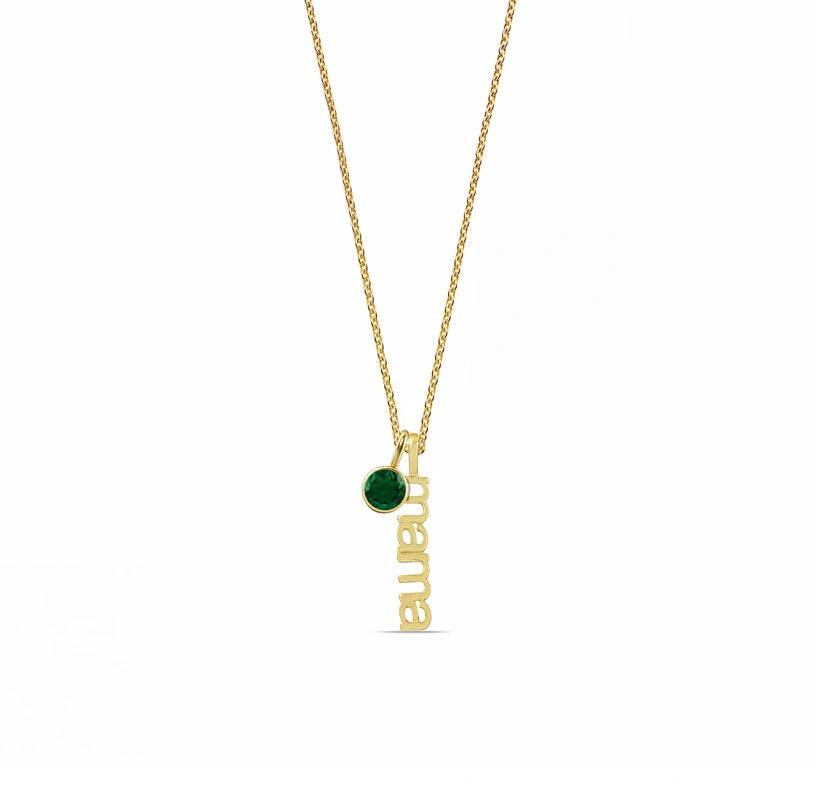 An emerald birthstone necklace featuring a rich green gemstone set in an elegant pendant, adding a timeless and sophisticated touch to any outfit.