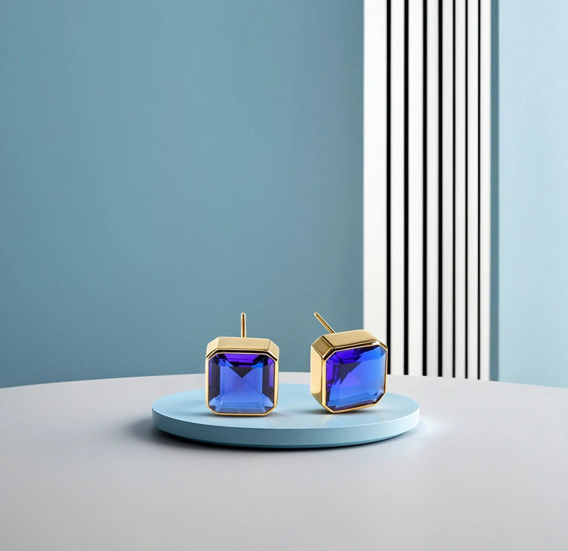 18K yellow gold-plated studs with 10mm Asscher cut Blue Sapphire.