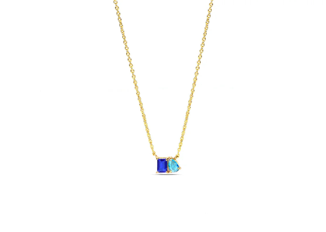 Close-up of Toi et Moi pendant ladies sapphire necklace showing both gemstones